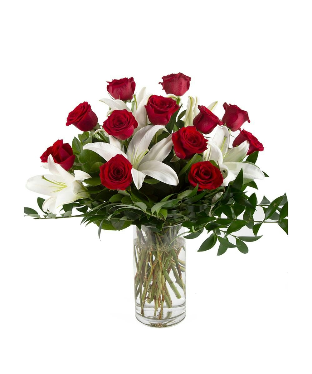 Roses and lilies by Eastern Floral Flower Delivery Grand Rapids, Michigan